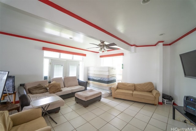 tiled living room featuring ceiling fan, crown molding, and a wealth of natural light