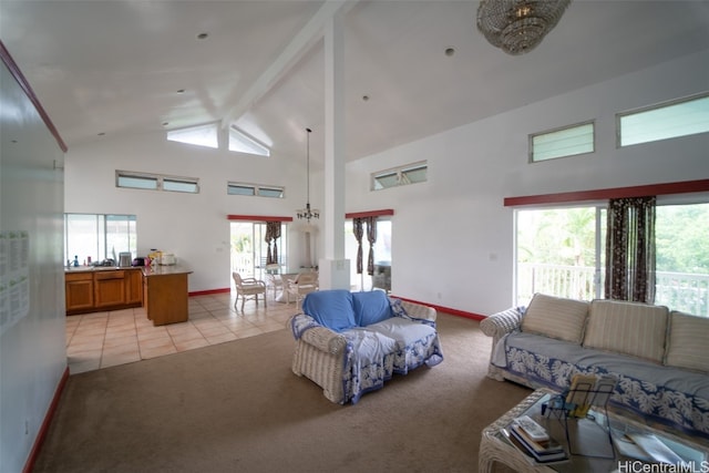 carpeted living room with high vaulted ceiling and beamed ceiling