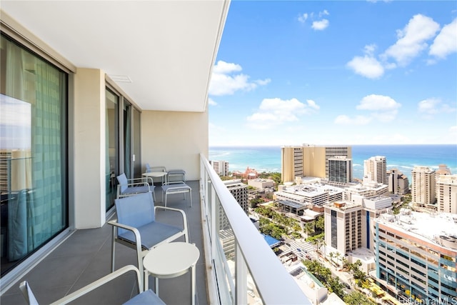 balcony featuring a water view