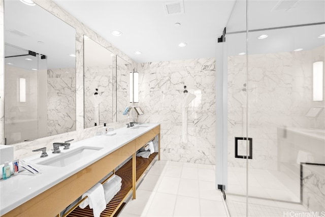 bathroom featuring tile walls, vanity, and a shower with shower door