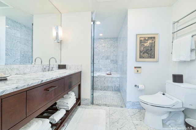 bathroom featuring vanity, toilet, and a tile shower