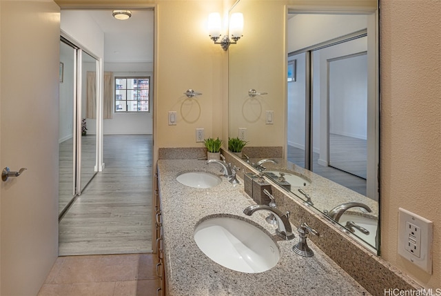 bathroom featuring vanity and hardwood / wood-style floors