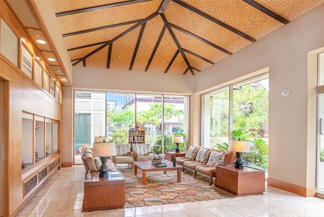 sunroom / solarium with lofted ceiling with beams