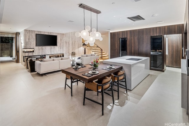 dining room featuring wood walls