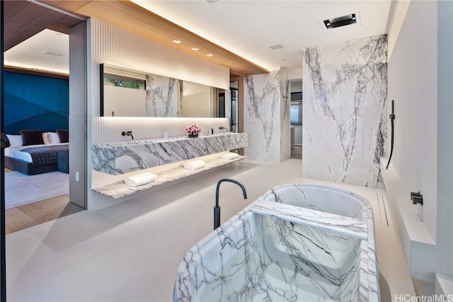 bathroom featuring a washtub