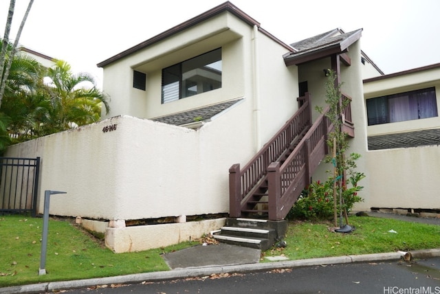 view of side of home featuring a yard