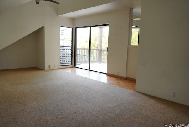 unfurnished room with light carpet and ceiling fan