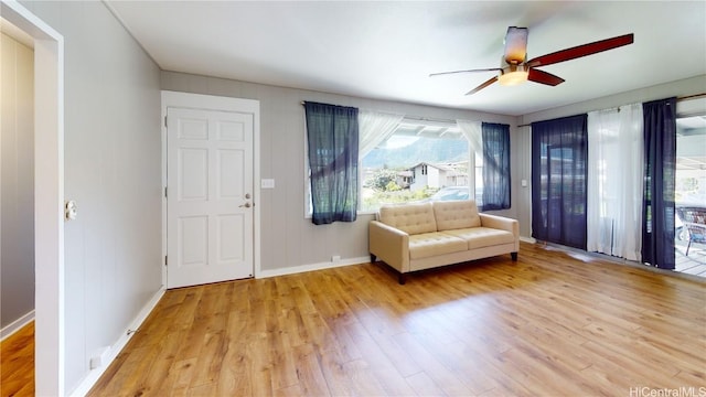 unfurnished room featuring ceiling fan and light wood-type flooring