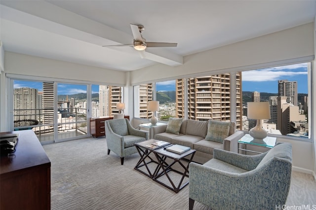 living room featuring carpet flooring and ceiling fan