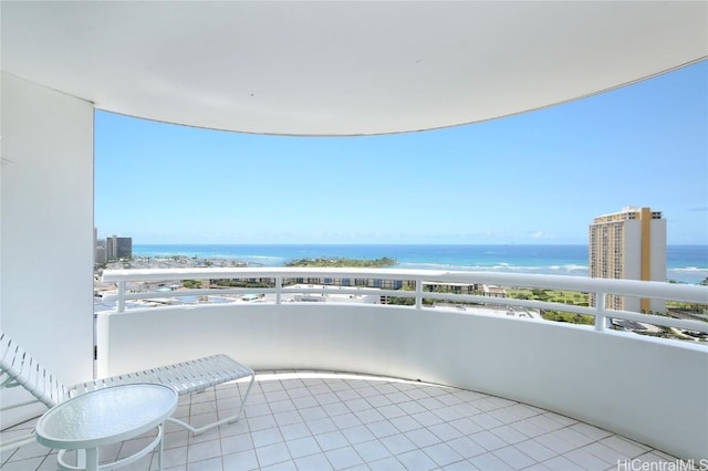 balcony featuring a water view