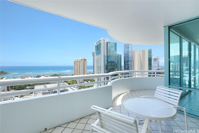 balcony featuring a water view and a view of city