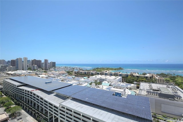 birds eye view of property with a view of city and a water view