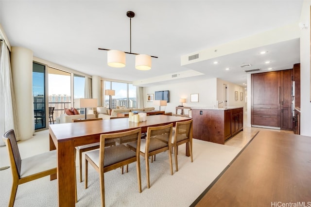 dining area with floor to ceiling windows