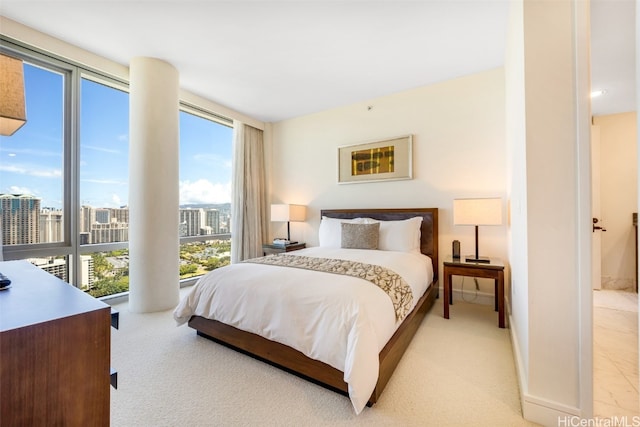 bedroom featuring light carpet