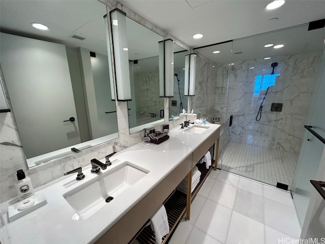 bathroom with vanity, tile walls, tile patterned flooring, and an enclosed shower