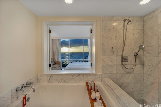 bathroom featuring separate shower and tub