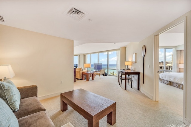 living room with light carpet and vaulted ceiling