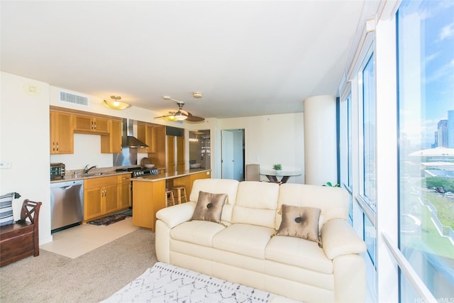 living room featuring light colored carpet and a ceiling fan