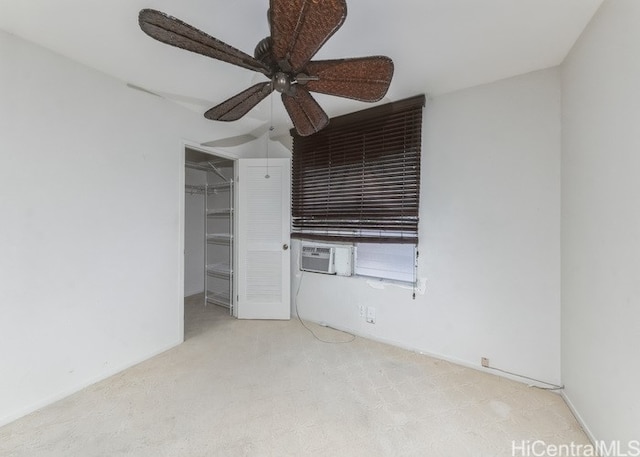 unfurnished bedroom featuring a closet, ceiling fan, light carpet, and cooling unit