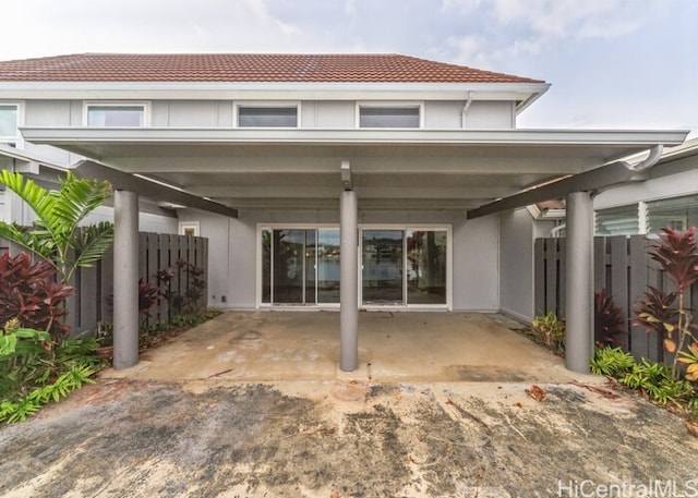 rear view of property featuring a carport