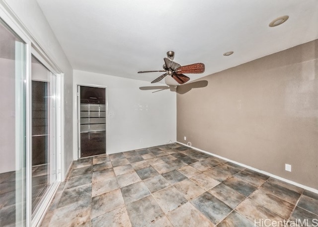 spare room featuring ceiling fan