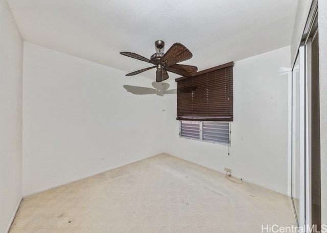 unfurnished bedroom with a textured ceiling and ceiling fan