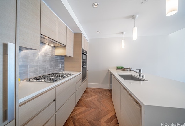 kitchen with black double oven, pendant lighting, stainless steel gas cooktop, sink, and ventilation hood