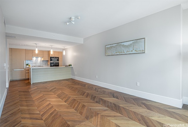 unfurnished living room featuring dark parquet flooring