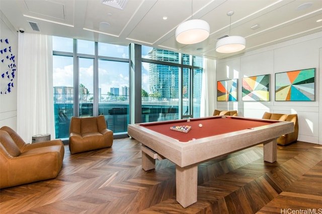 recreation room with floor to ceiling windows, pool table, parquet floors, and plenty of natural light