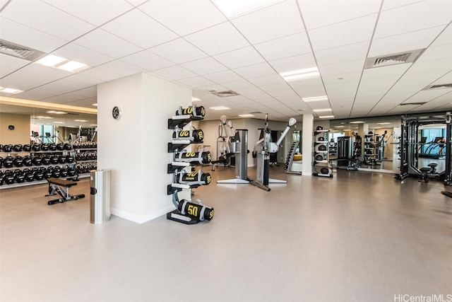 workout area with a paneled ceiling