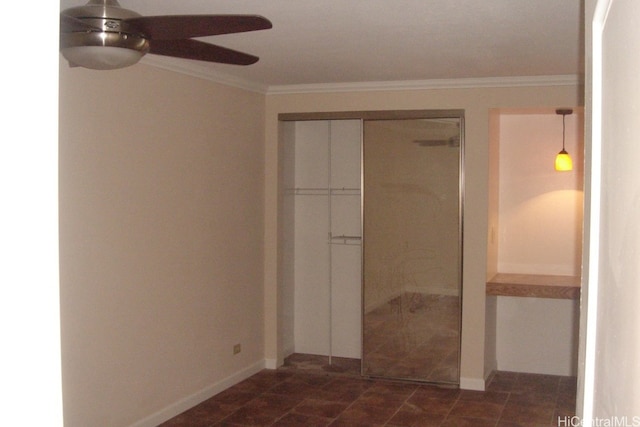 unfurnished bedroom with a closet, ornamental molding, and ceiling fan