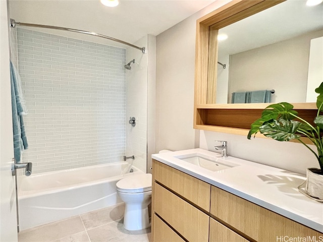 full bathroom with vanity, toilet, tile patterned flooring, and tiled shower / bath