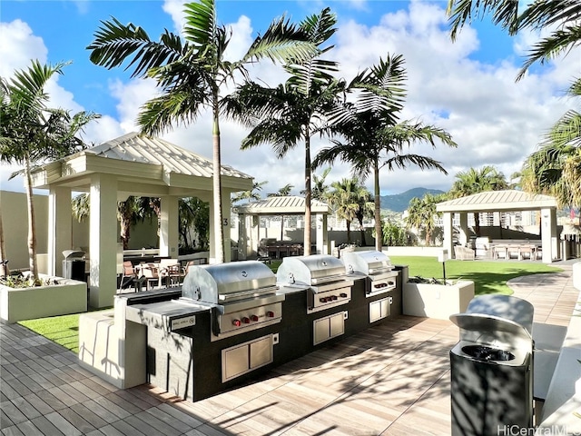 view of patio / terrace featuring a gazebo, an outdoor kitchen, and grilling area