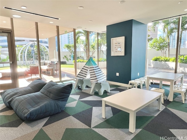 recreation room featuring carpet flooring