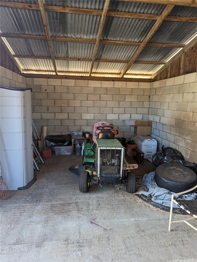 garage with concrete block wall