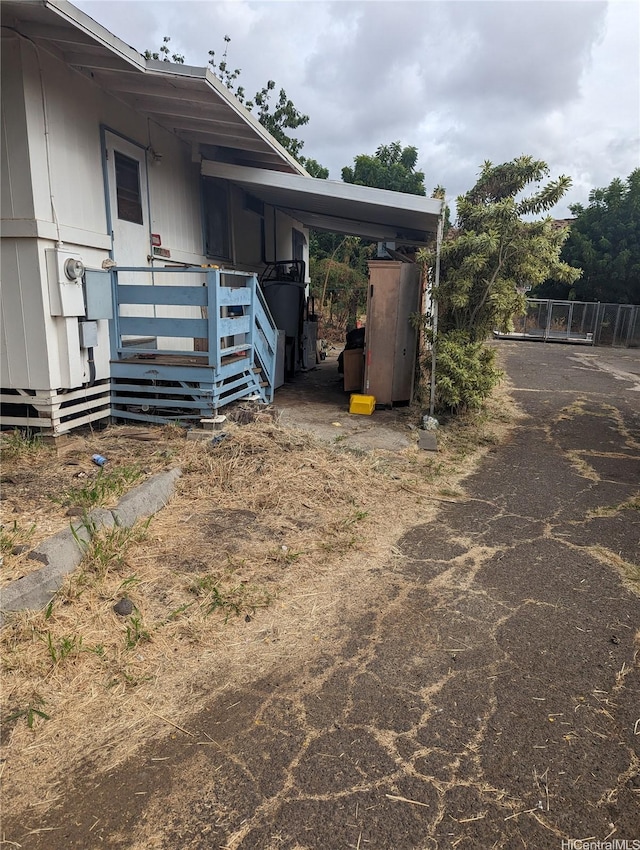 exterior space with an attached carport