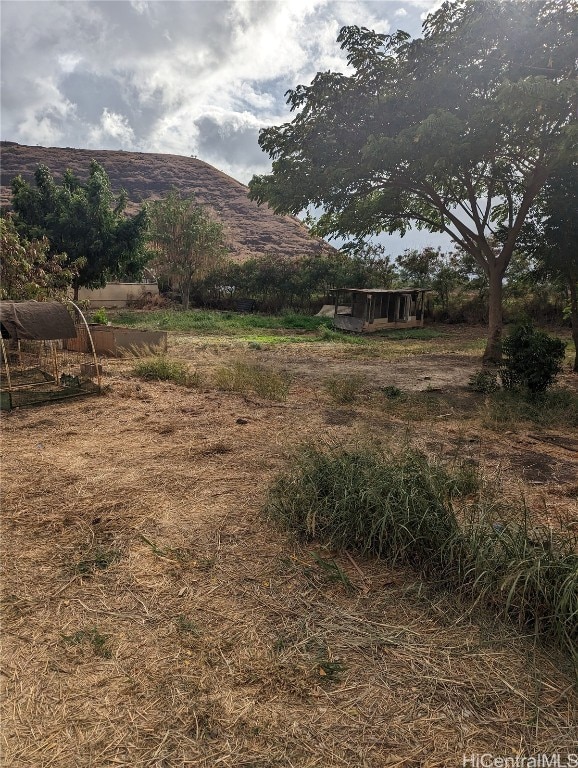 view of mountain feature with a rural view