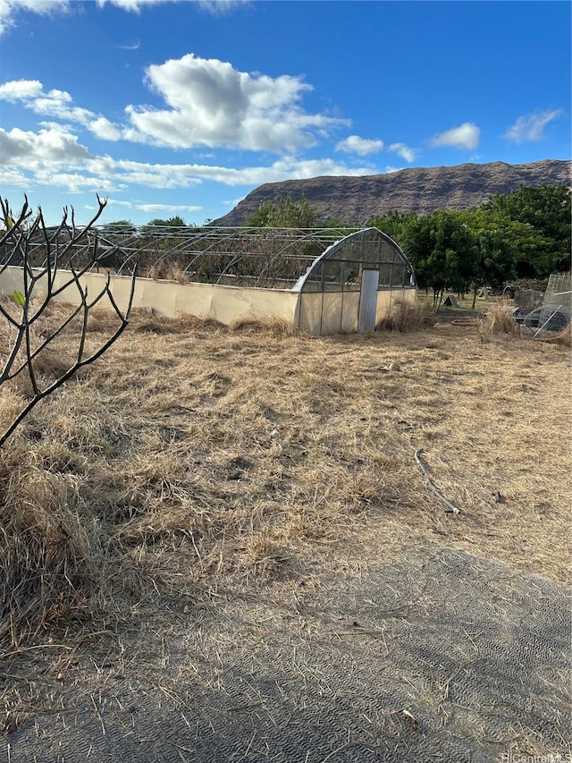 exterior space with a rural view and a mountain view