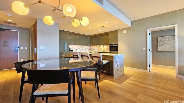 dining area with light wood-type flooring