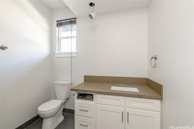 bathroom featuring toilet and vanity