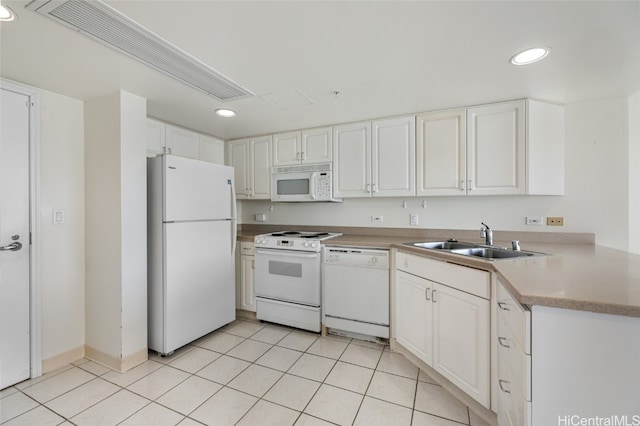 kitchen featuring white cabinets, sink, light tile patterned floors, and white appliances