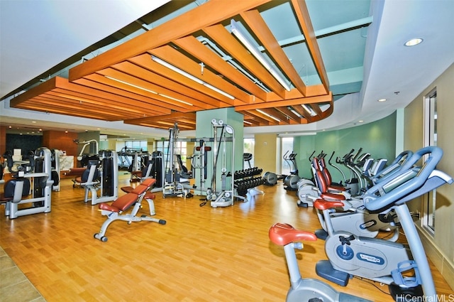 workout area with hardwood / wood-style flooring