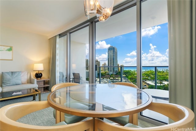 dining space featuring an inviting chandelier and a healthy amount of sunlight