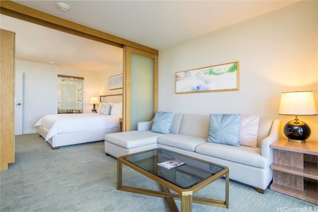 bedroom featuring light colored carpet