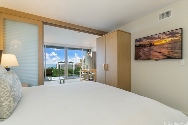 bedroom with a wall of windows