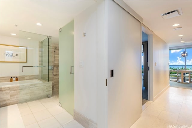 interior space featuring an inviting chandelier and light tile patterned floors