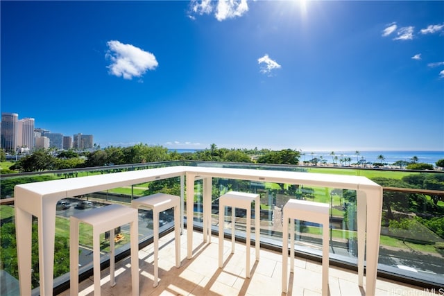 balcony featuring a water view