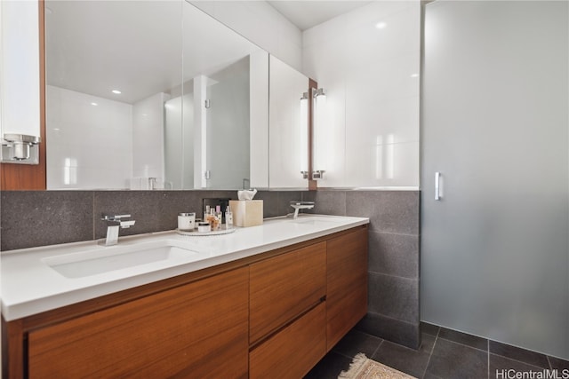 bathroom featuring tile walls, vanity, and tile patterned flooring