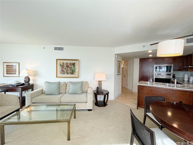 living room featuring light carpet