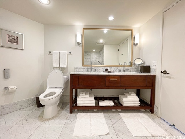 bathroom with toilet, an enclosed shower, and vanity